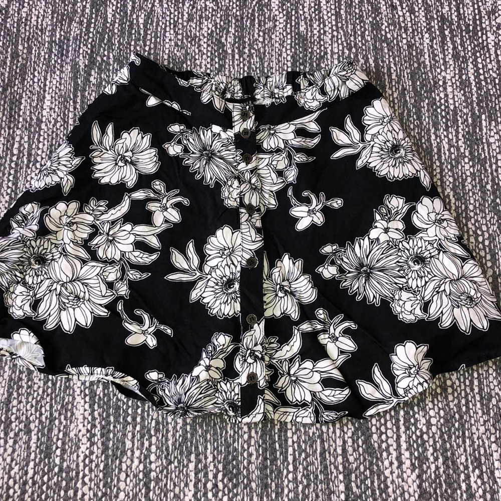 Black floral mini skirt. NEW WITH TAGS!